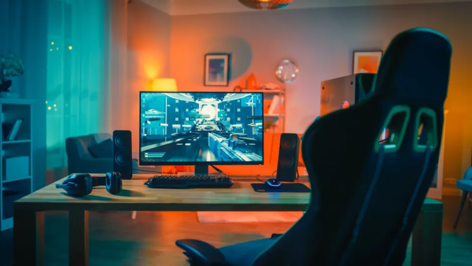 Gaming PC setup with monitor, speakers and gaming chair